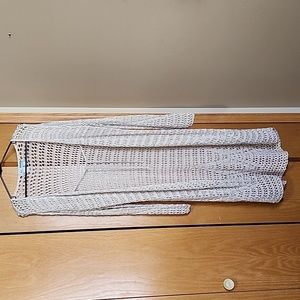 Women's long open knit cardigan with tie front.